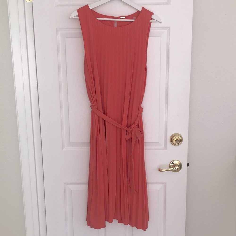 Coral pleated sleeveless dress